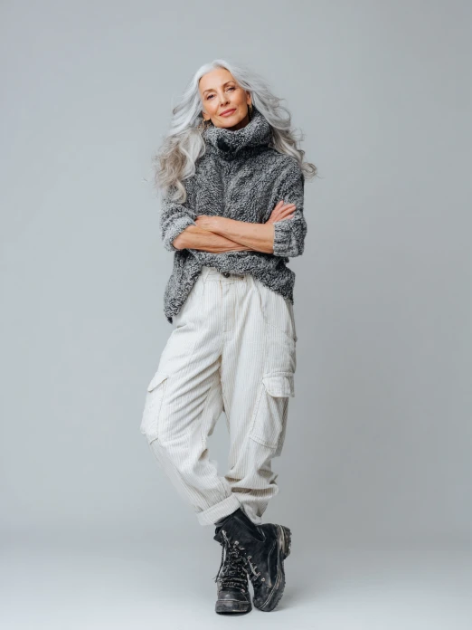 mature ai generated female model presenting streetwear style on a clean background